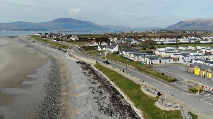 Cranfield Beach and its seafront at the mouth of Carlingford Lough with mountains beyond