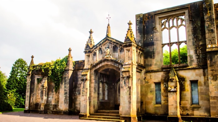 The Gothic archway and ruined facade of Drum Manor