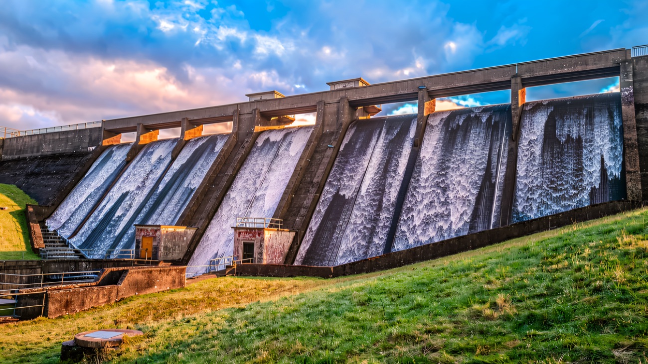 Water sheeting down the stepped face of the reservoir dam