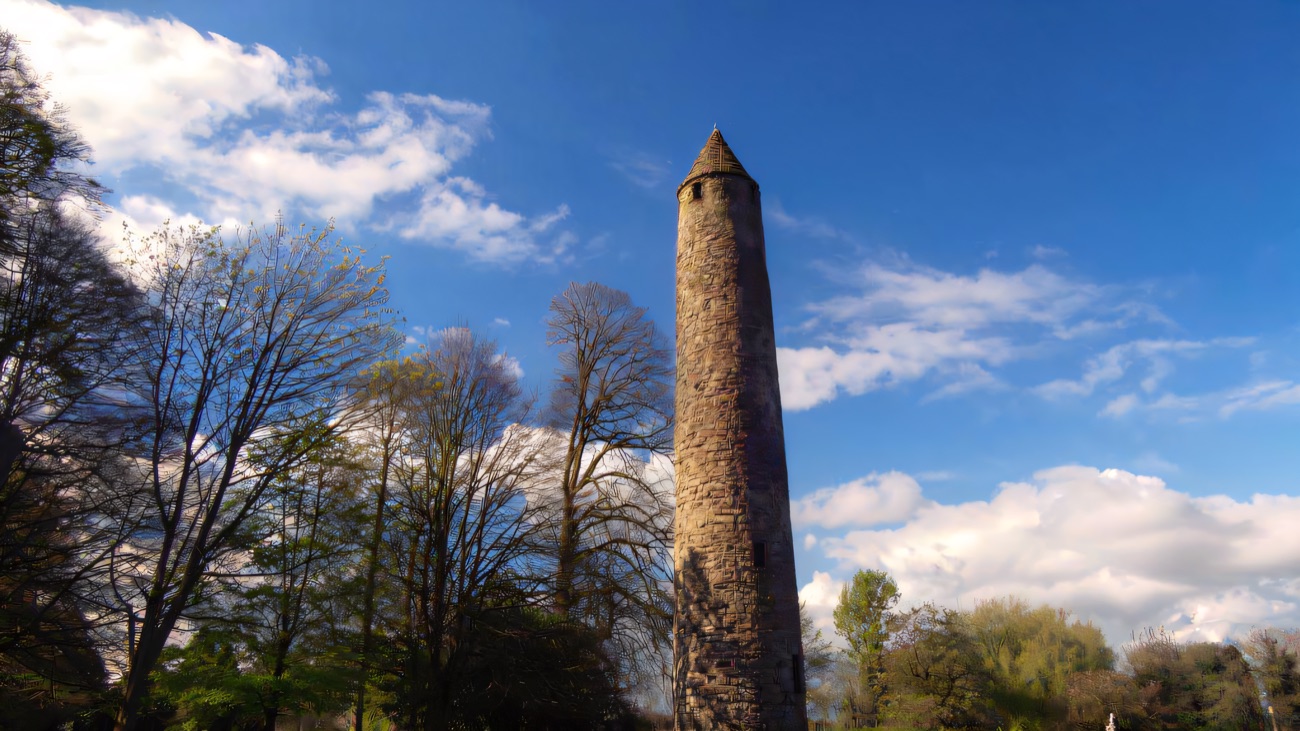 The tower framed by bare spring trees, one of the finest surviving in Ireland