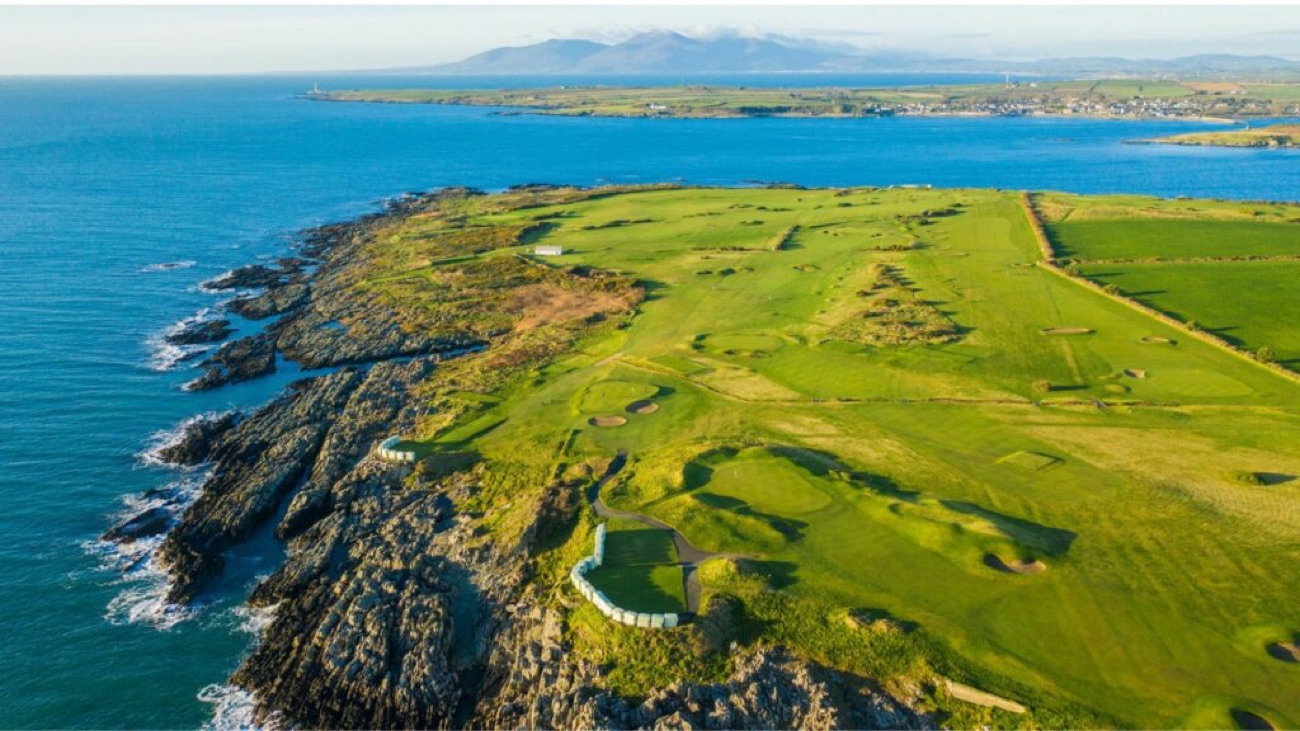 Ardglass links golf course running along the rocky County Down coast with the Mourne Mountains across the water