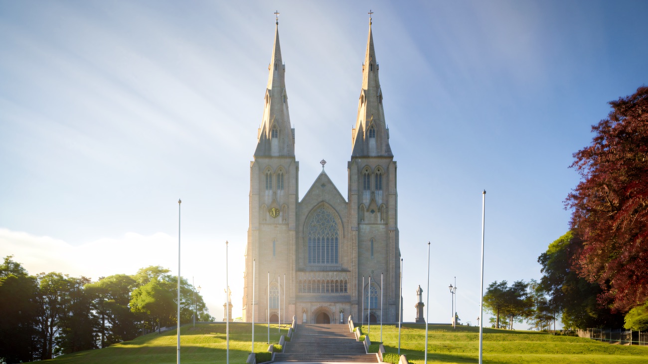 The twin spires of the Roman Catholic cathedral rise above the grand flight of steps on the hill.