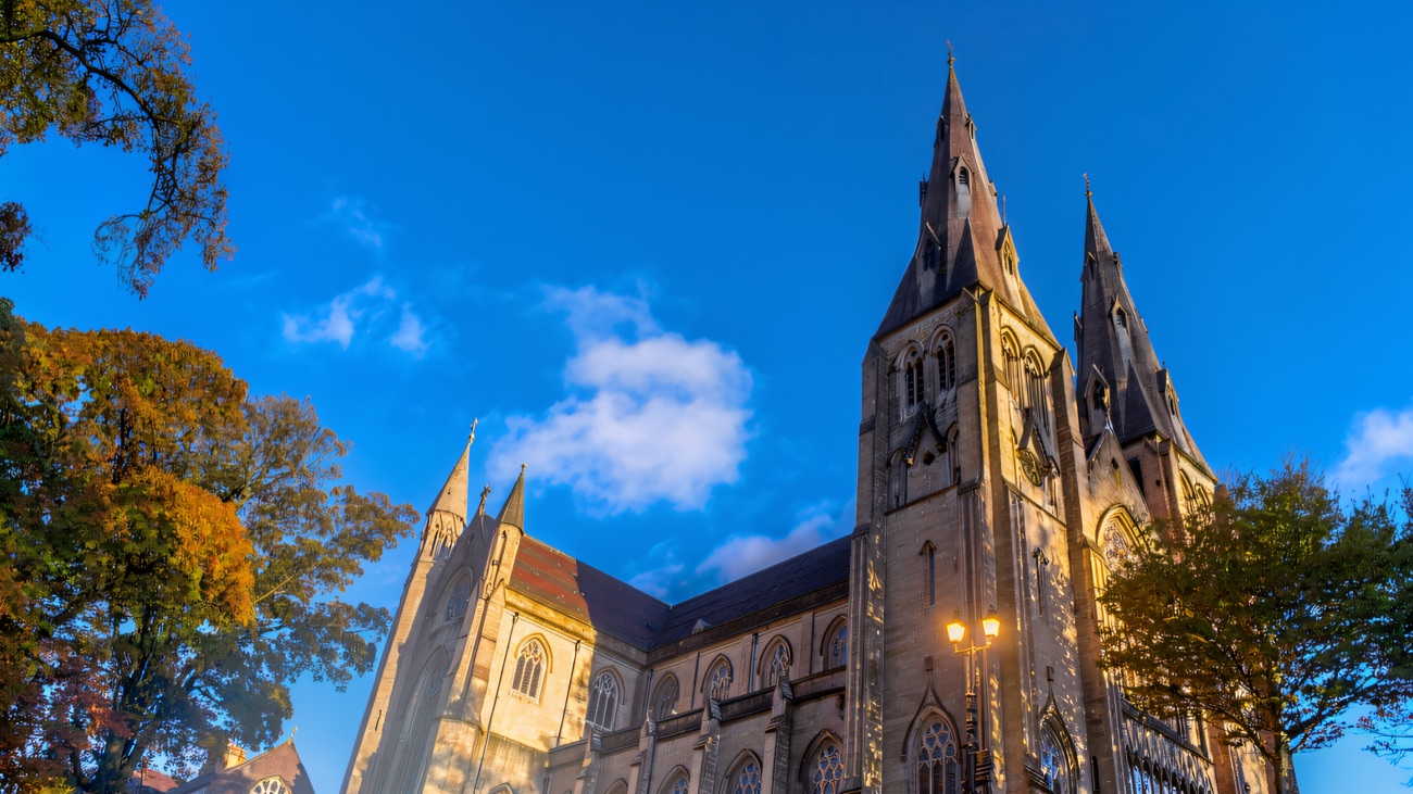 The long side of the cathedral seen in autumn, showing its full sweep along the ridge.