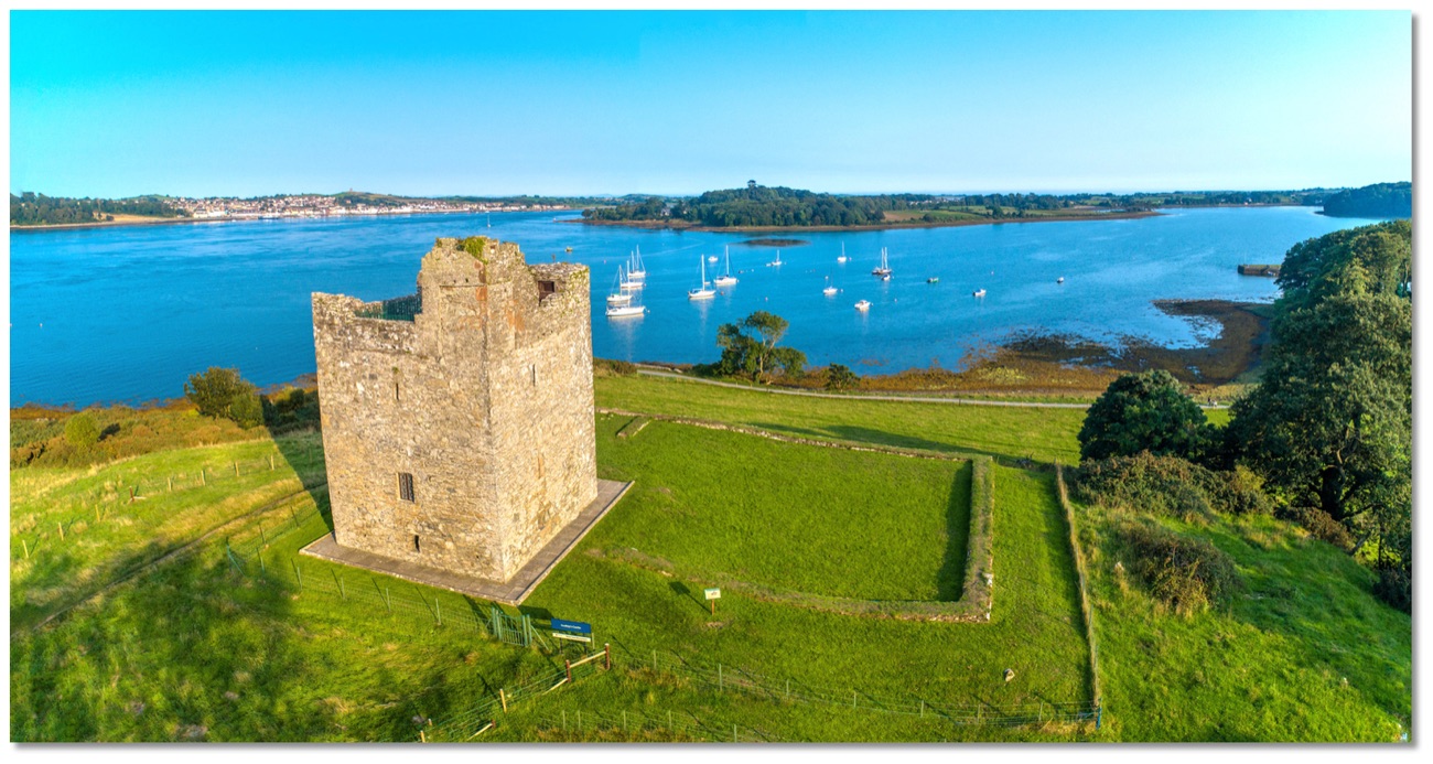 Aerial view of Audley's Castle on its hill above Strangford Lough with sailing boats moored below