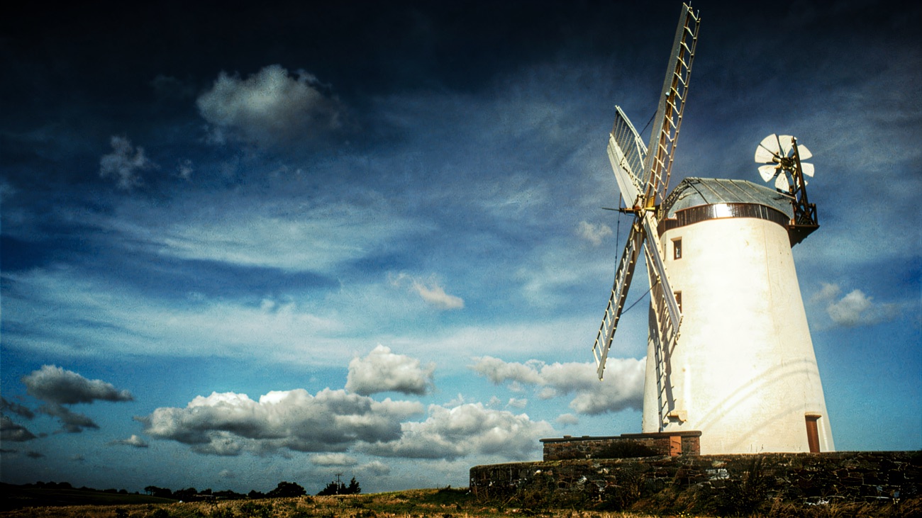 The tower and sails set against a big County Down sky.
