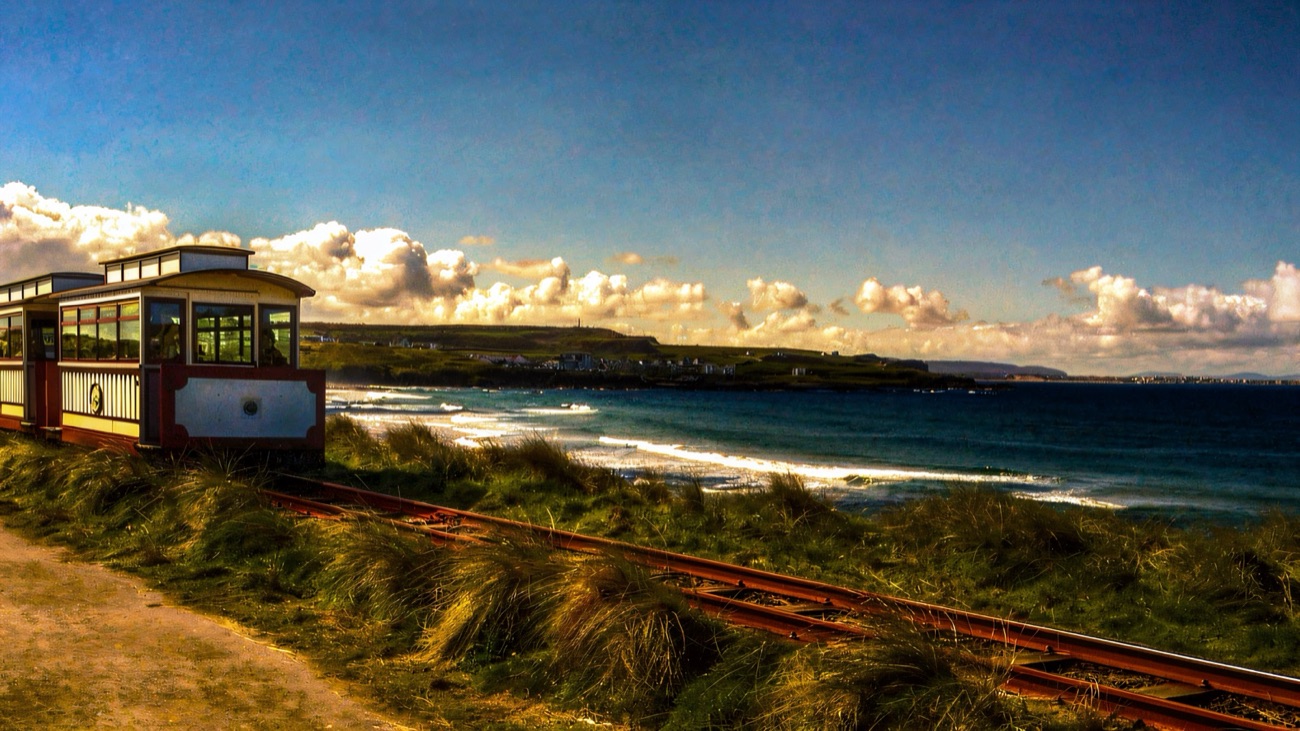 A heritage railway carriage on the narrow-gauge line beside the sea near Bushmills