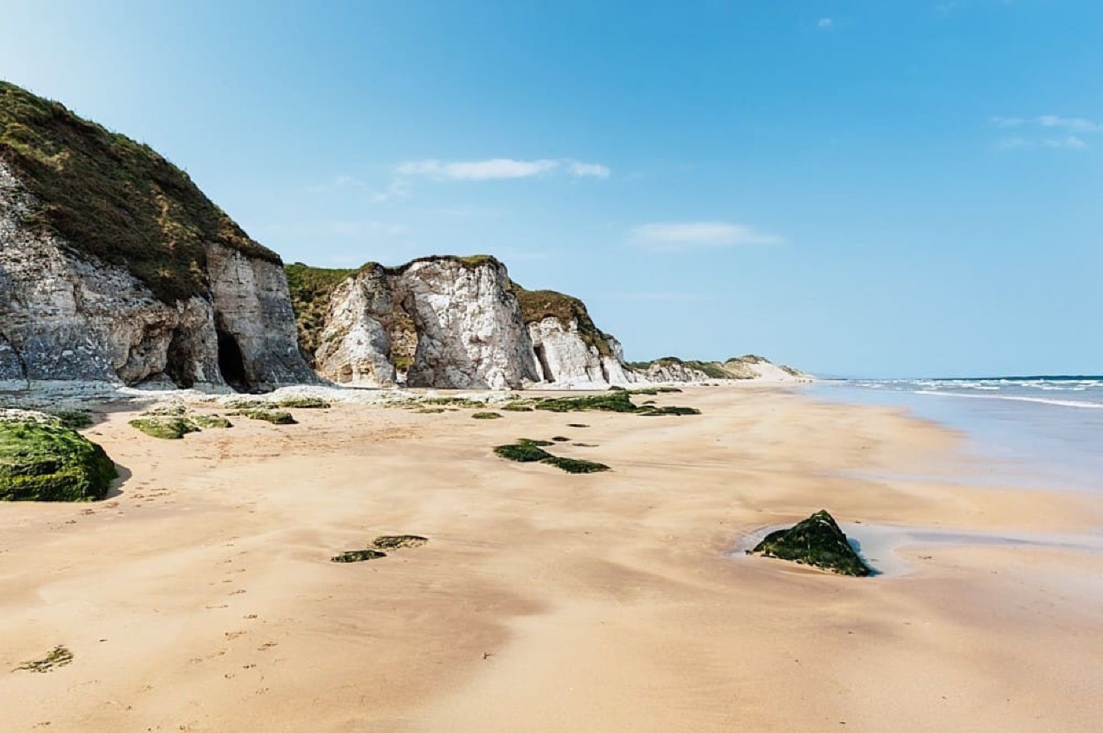 White limestone cliffs and golden sand at Whiterocks Beach