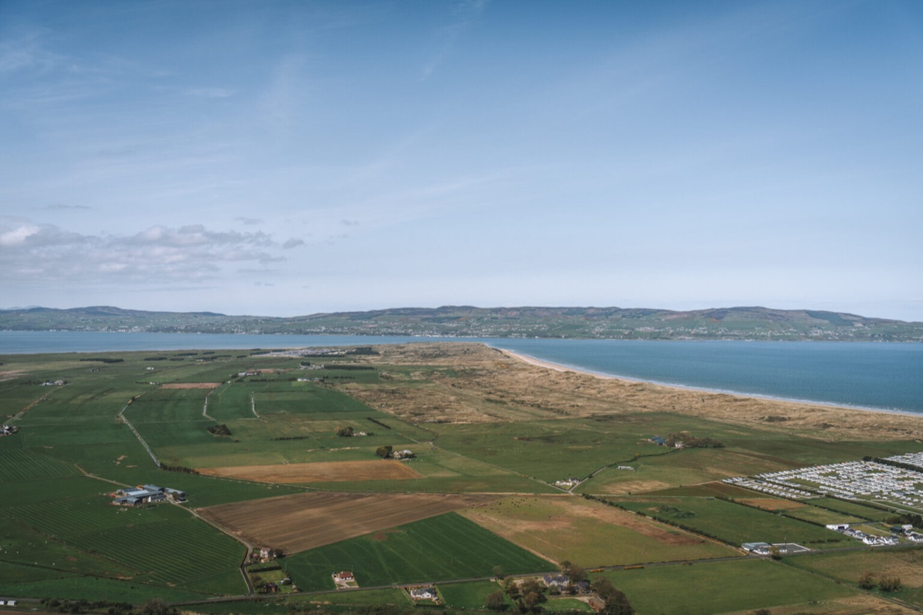 The wide coastal plain of Magilligan stretching out to Lough Foyle and the hills of Donegal beyond