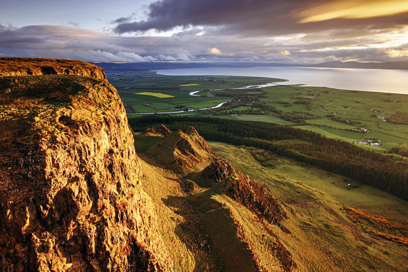 Golden evening light on the Binevenagh cliffs above the coast — the Game of Thrones Dragonstone scenery