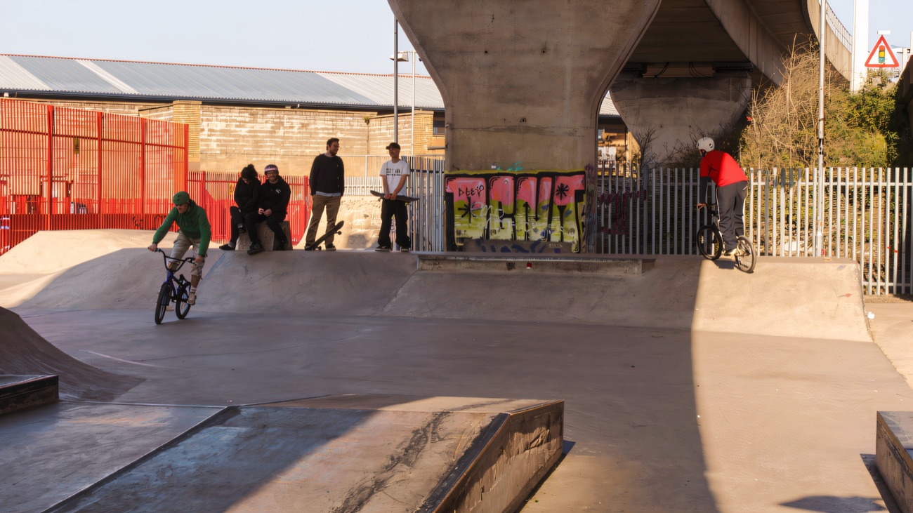 Wide view of the concrete park sheltered beneath the road bridge
