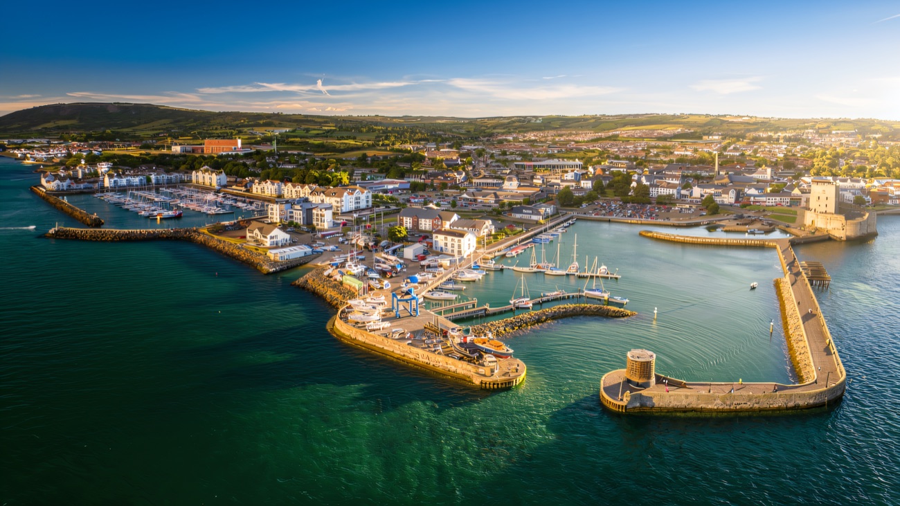 Carrickfergus marina and its ancient castle from the air