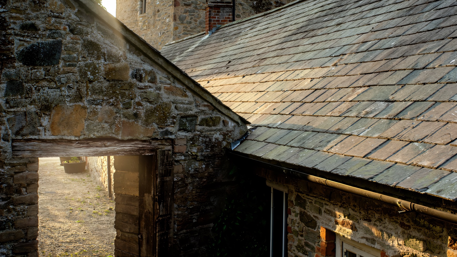 The stone farmyard at Castle Ward with its tall tower house — the courtyard used as Winterfell in Game of Thrones