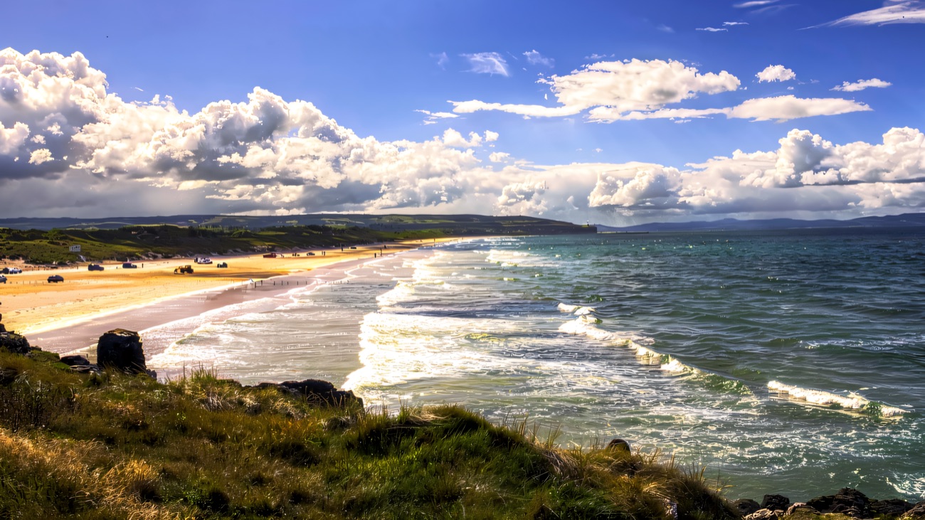 The long sweep of strand and turquoise sea that the coastal route follows