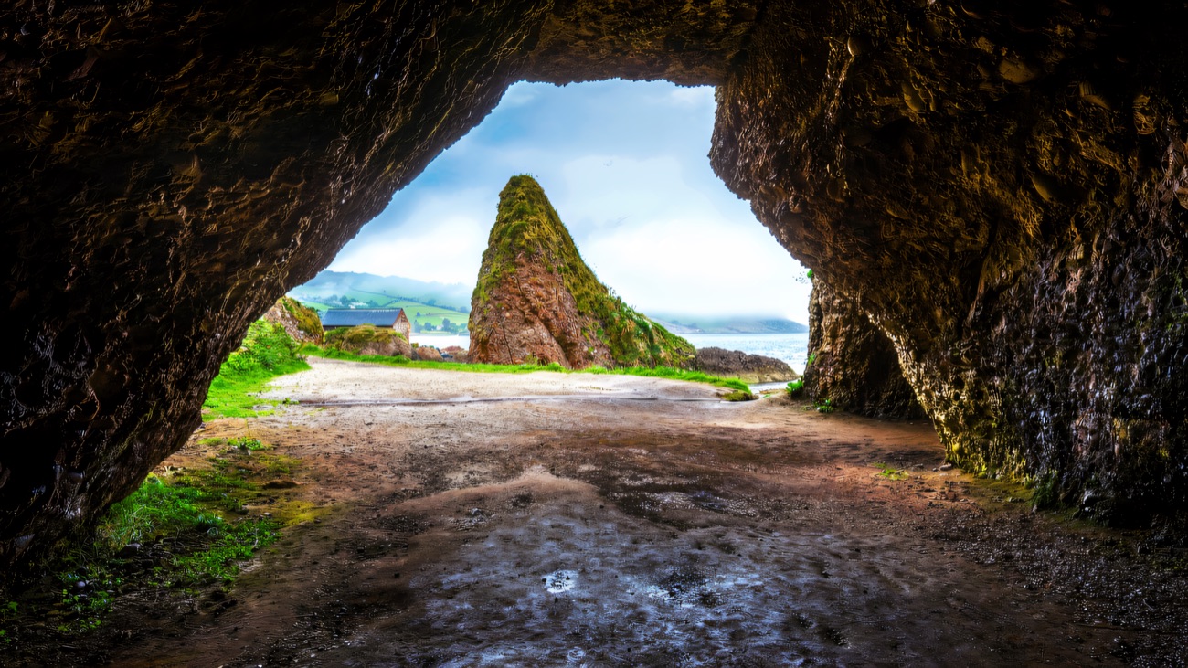 Inside the Cushendun caves, looking out to the sea stack