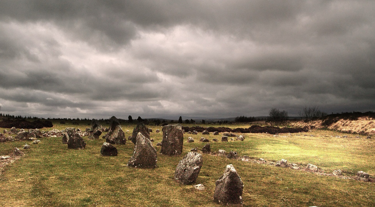 The ancient stone circles and rows at Beaghmore under a big, dramatic Sperrin sky.