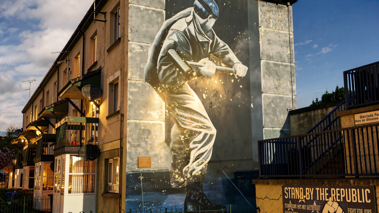 A People's Gallery mural filling the full gable end of a Rossville Street block.