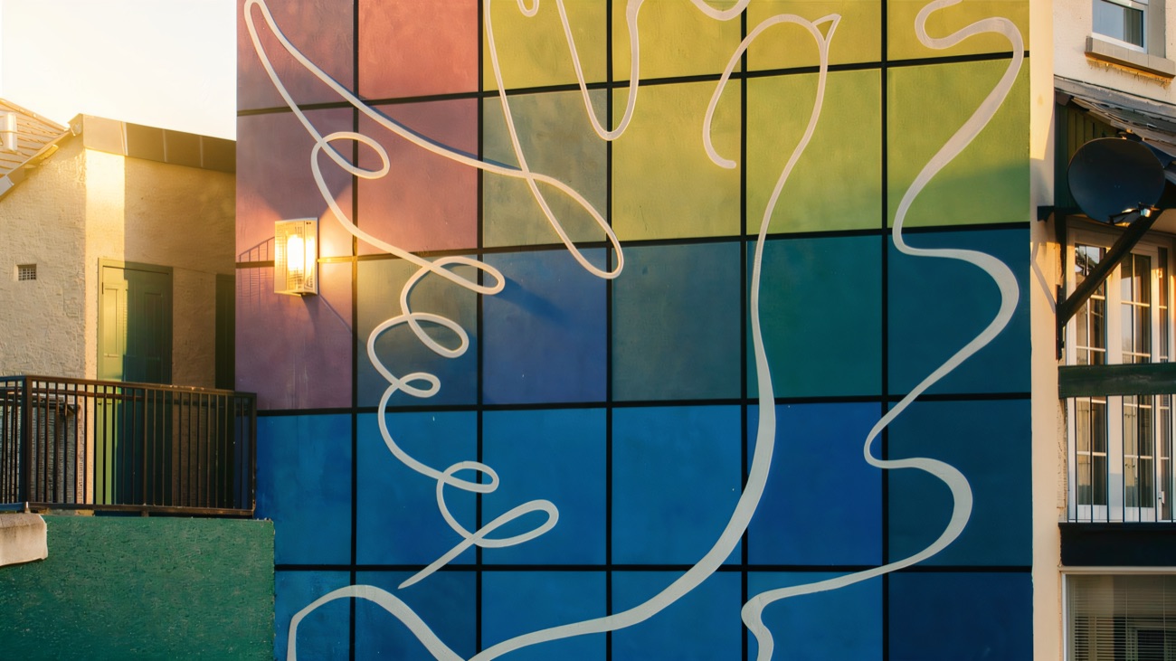 The Peace Dove mural in its grid of colours, a quieter note among the gallery.