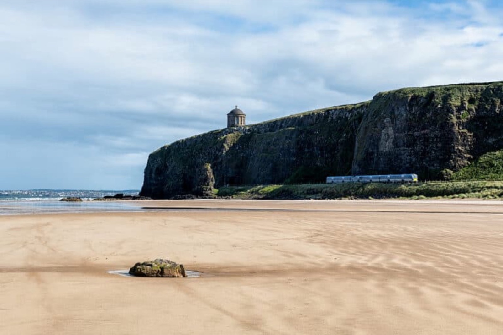 The empty strand at Downhill Beach beneath the Mussenden cliff