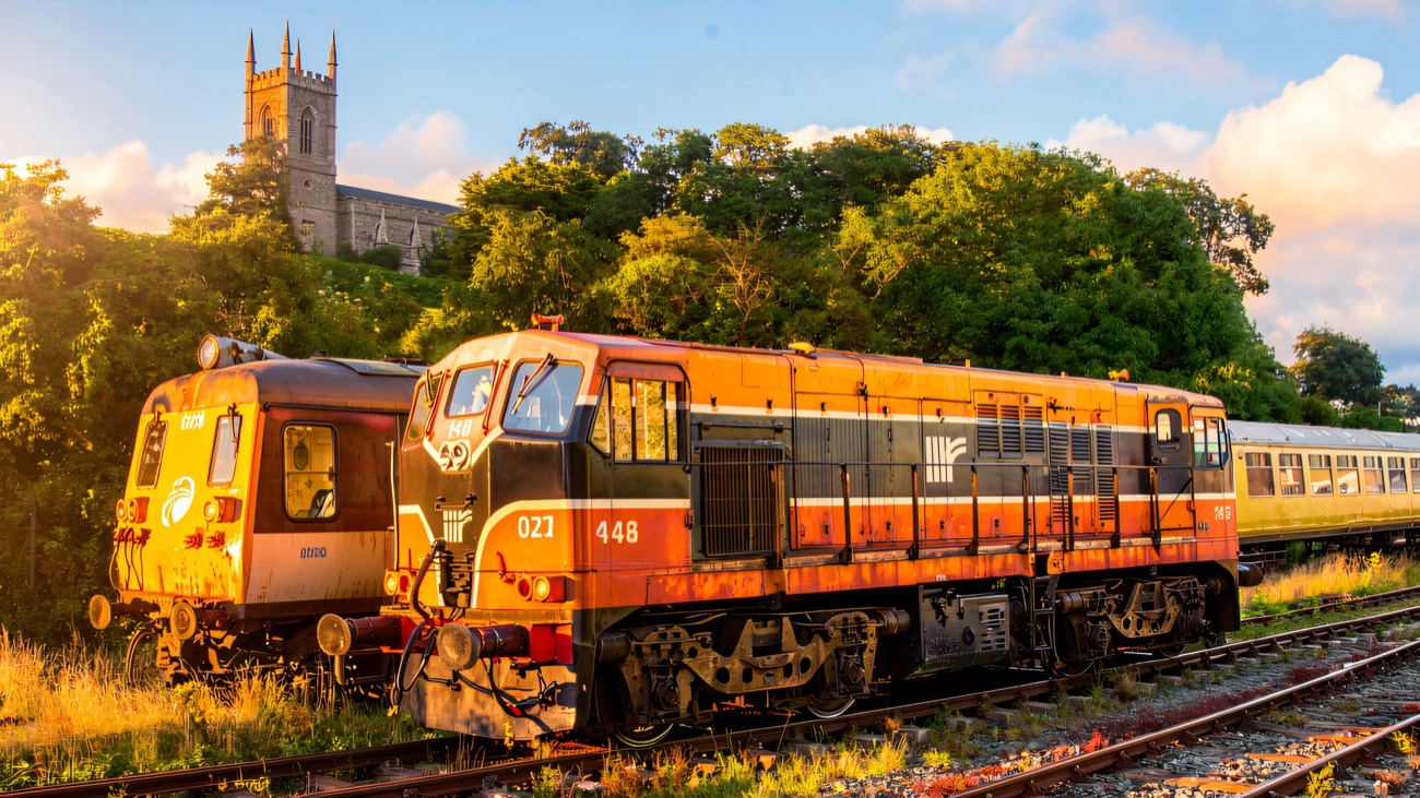 A heritage diesel on the line with the tower of Down Cathedral rising on the hill beyond.