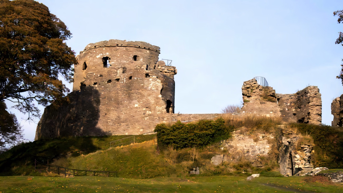 The great round keep of Dundrum Castle standing on its grassy motte