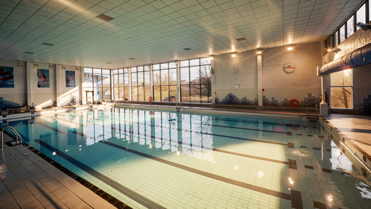 The refurbished main pool, with tall windows looking out over the countryside