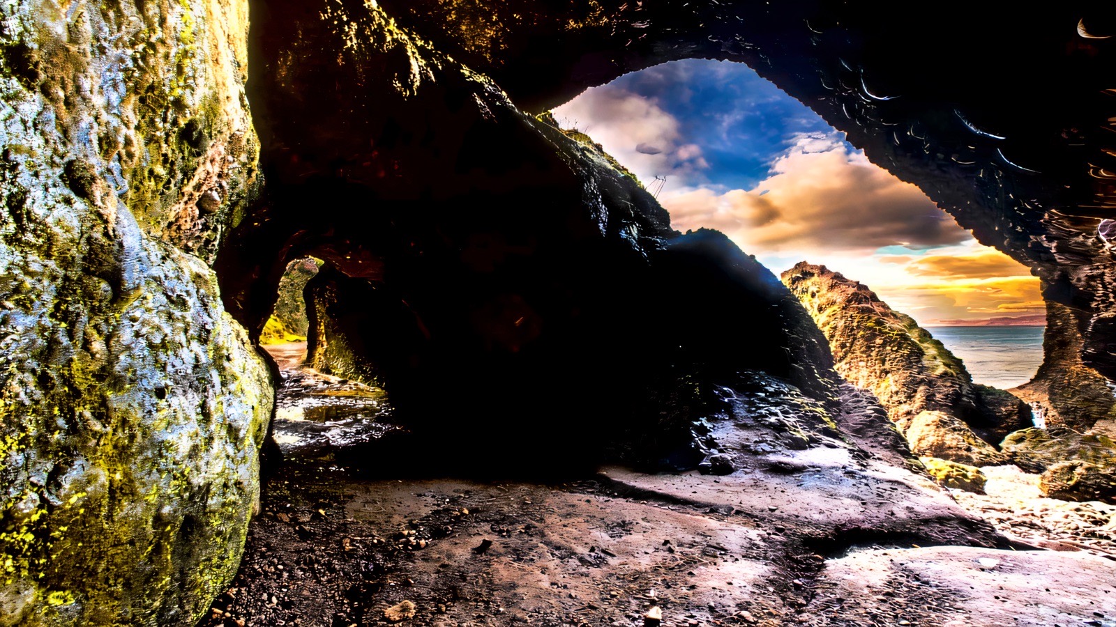 Sunset blazing through the arch of the Cushendun Caves
