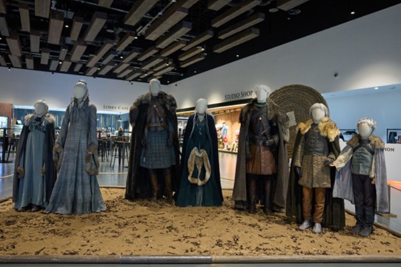 A line of original Game of Thrones costumes displayed on mannequins near the lobby café