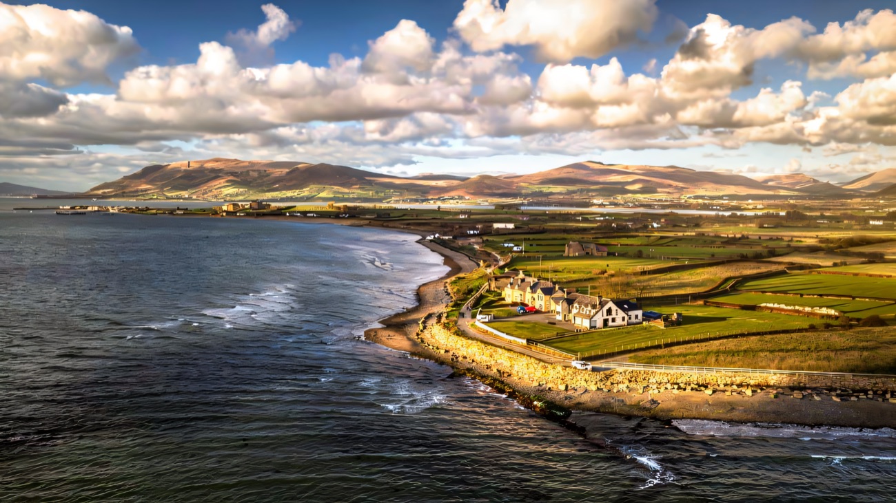 The Greencastle shore on Carlingford Lough with the Cooley mountains rising across the water