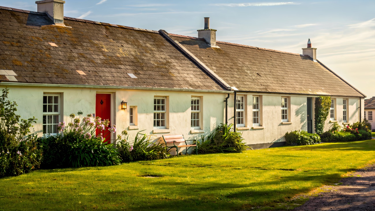 The National Trust cottages with their red doors and flower beds