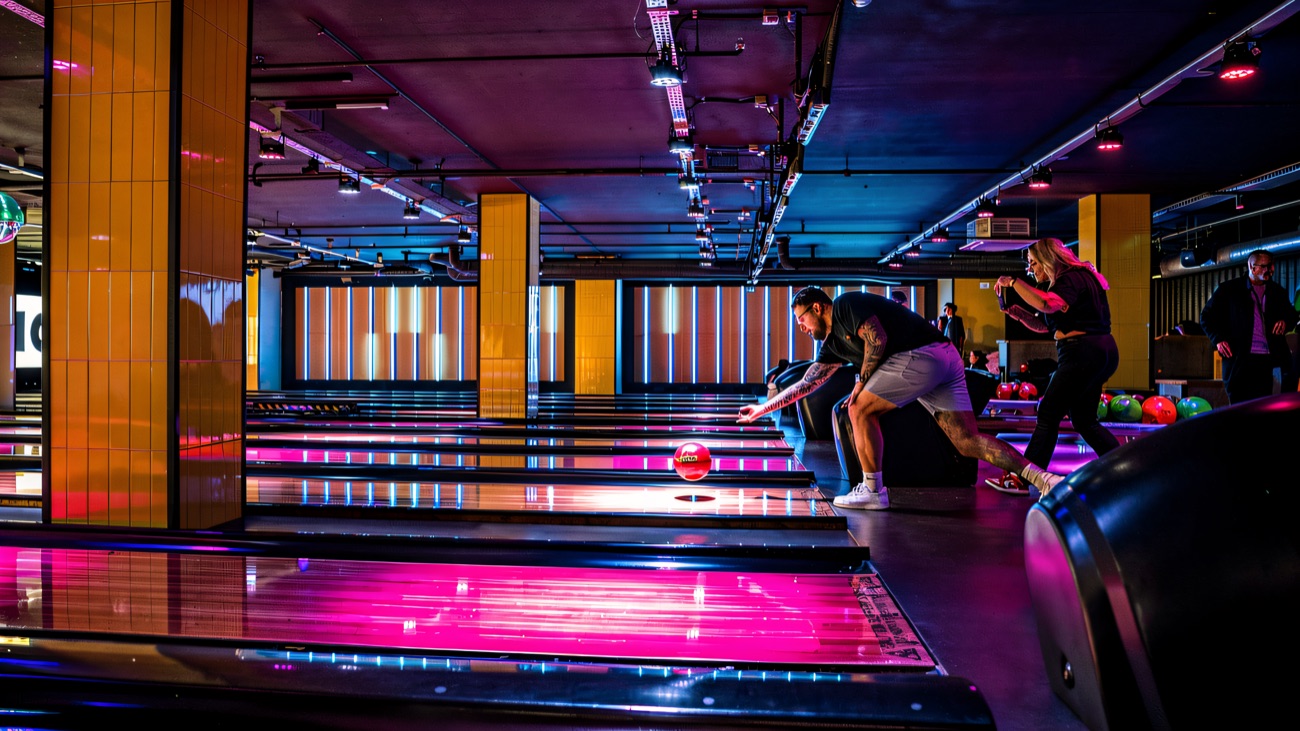King Pins' moody purple-and-pink neon tenpin lanes in full flow