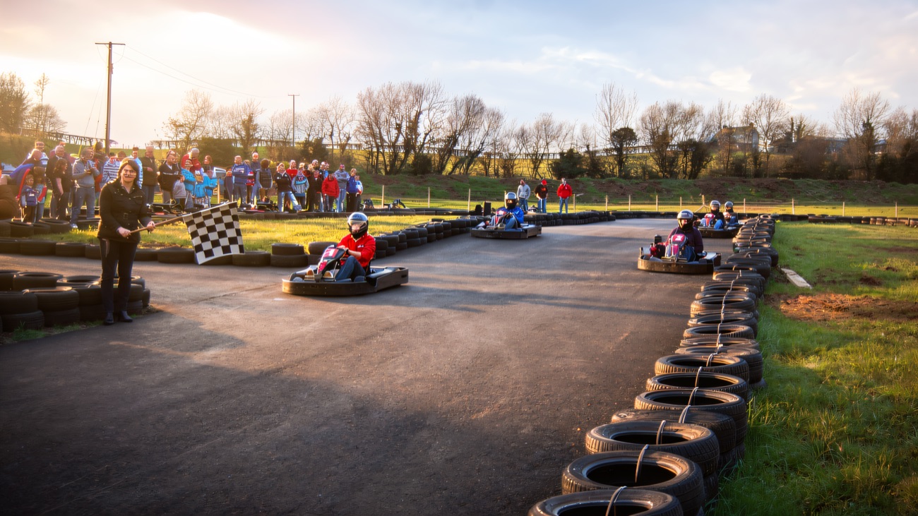 The chequered flag comes out as the karts take the finish