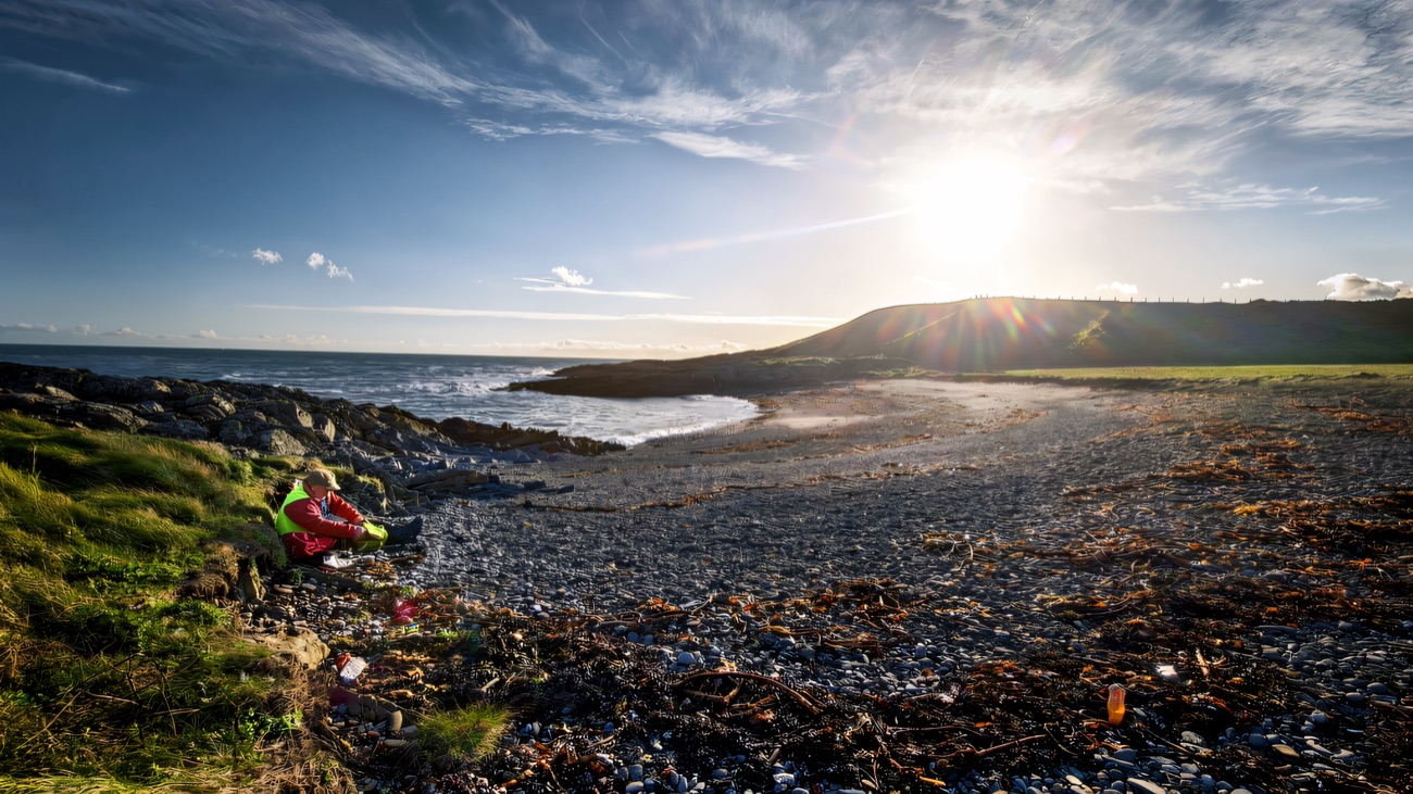 A pebble cove catching low winter sun along the coast