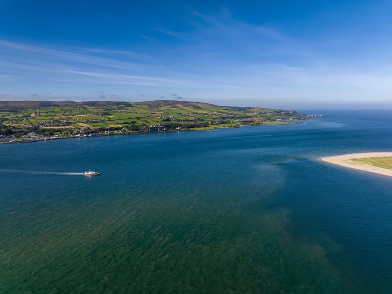 Aerial view across the mouth of Lough Foyle with the small ferry crossing towards the Donegal shore
