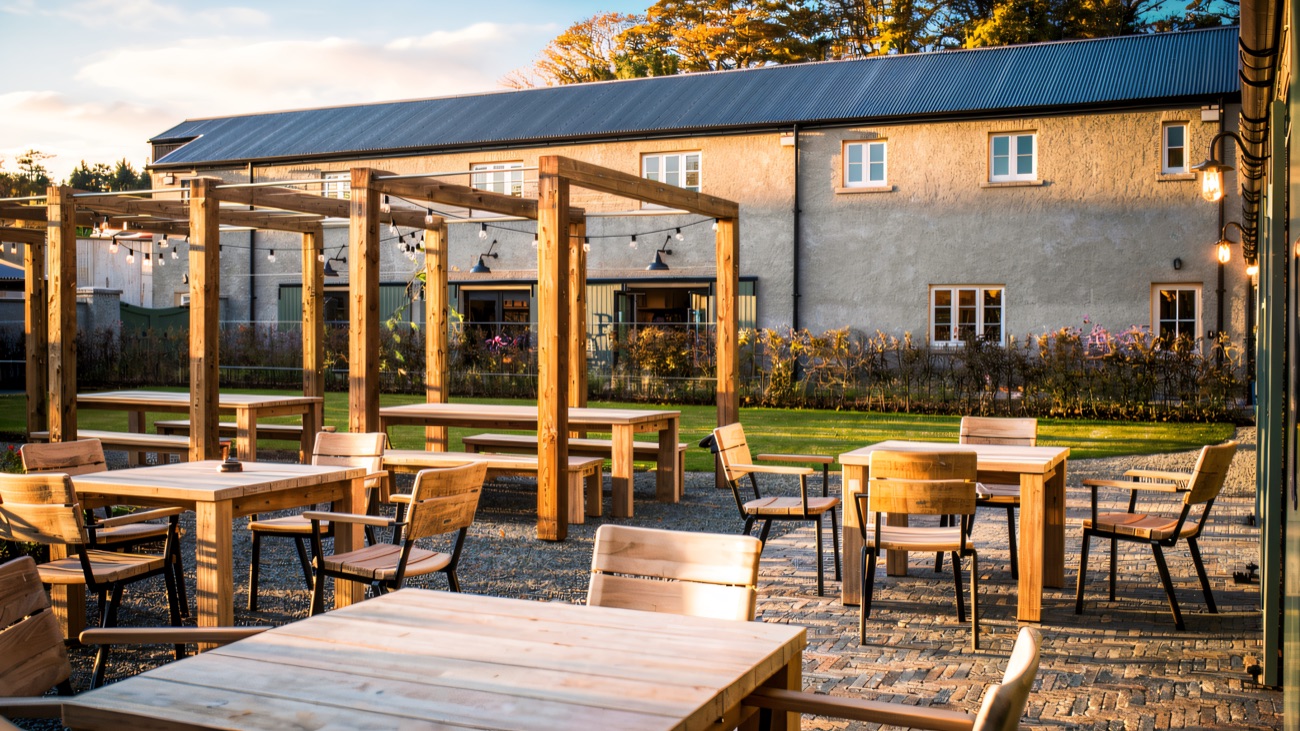 The courtyard café at The Carriage Rooms, with outdoor tables