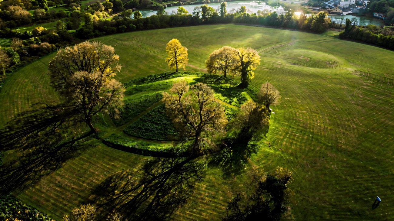 Navan Fort from the air, the ancient earthwork mound of Emain Macha ringed by its ditch.