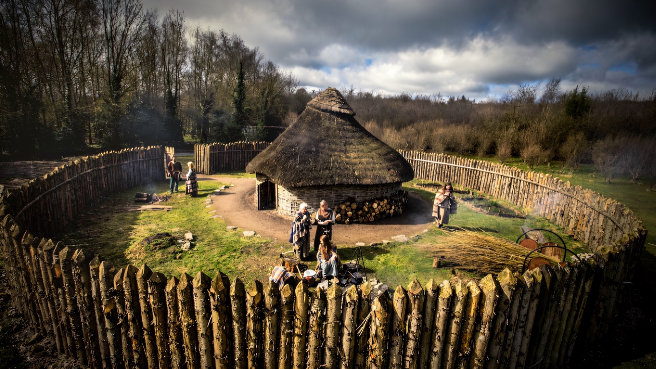 The reconstructed Iron Age roundhouse and timber palisade at the visitor centre bring the site to life.