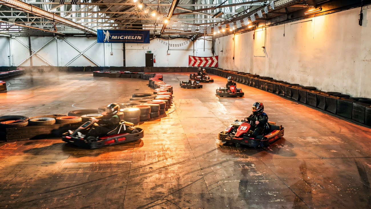 A wide view of the tyre-lined indoor karting track
