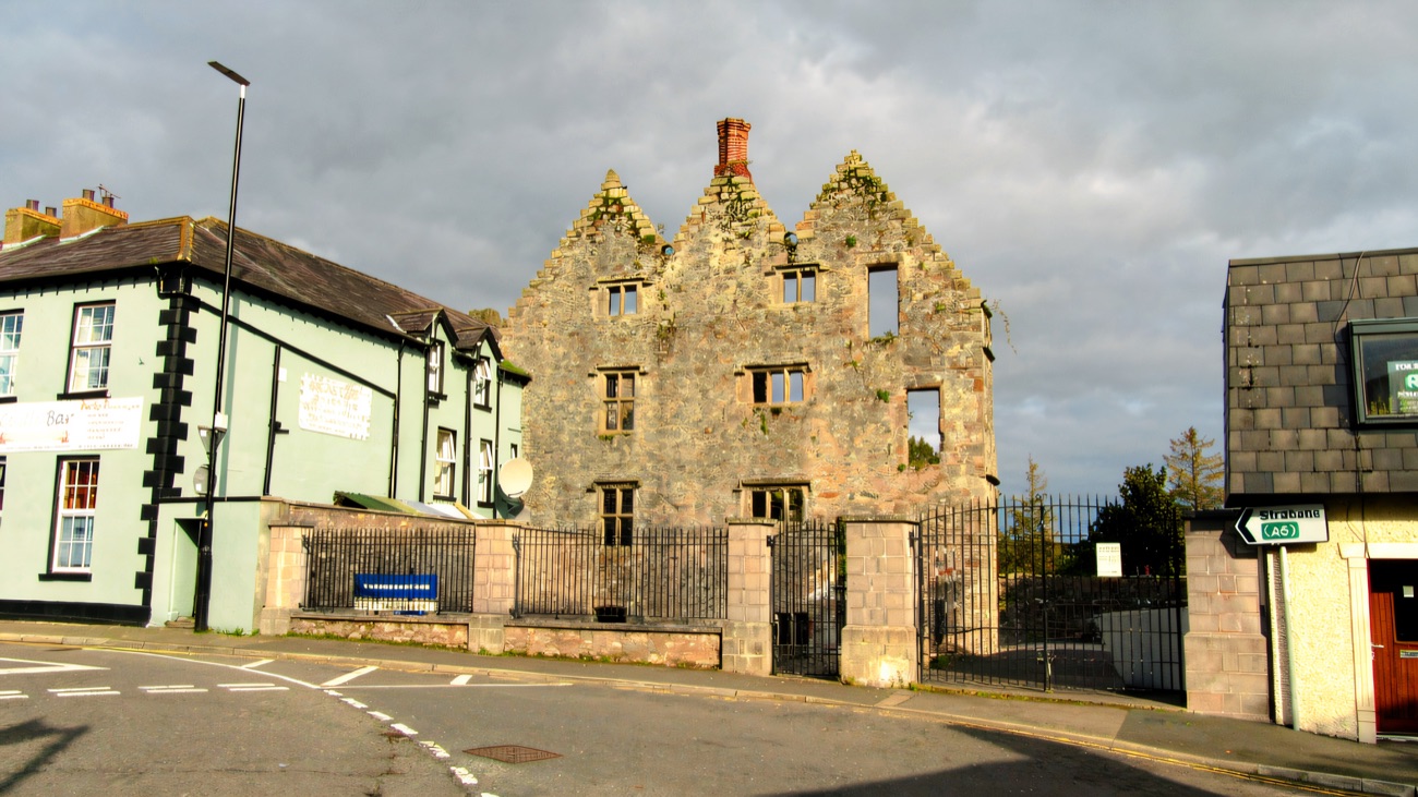 The gabled plantation tower house standing on the town street beside the old Castle Bar.