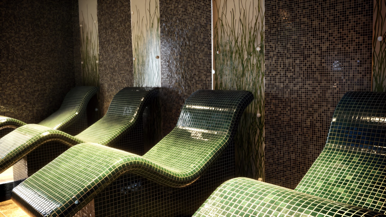 Heated tiled loungers in the quiet relaxation area