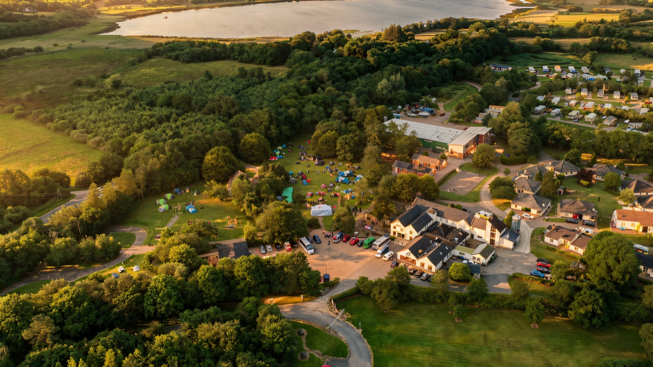The whole village from above, tucked between forest and lakeshore