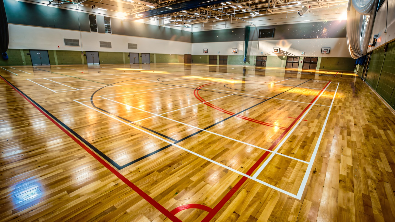 The sports hall with its pale wooden floor