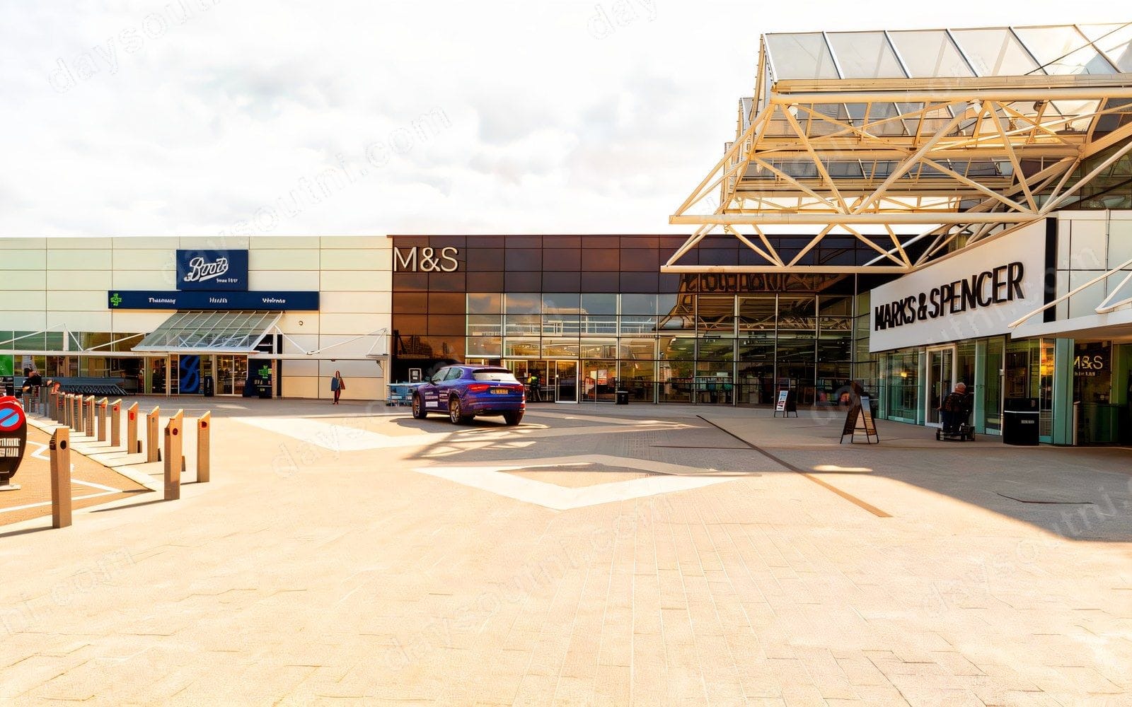 The main frontage of Sprucefield Centre, with the Boots and M&S stores either side of the gold lattice canopy at the Marks & Spencer entrance