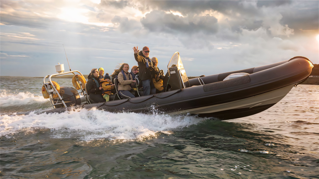 The RIB bounces across the lough at speed, passengers braced for the ride
