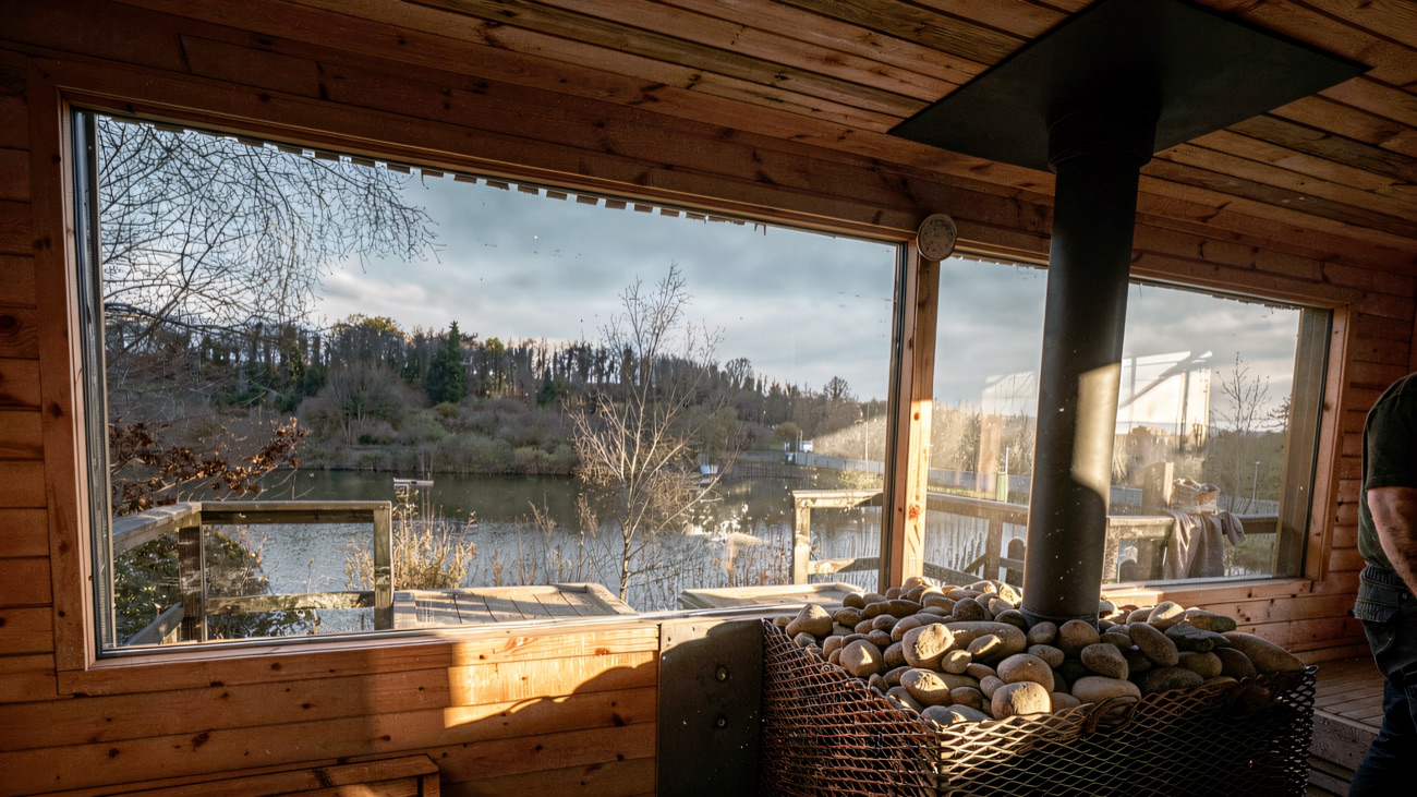 Stove stones with the lake and treeline through the glass