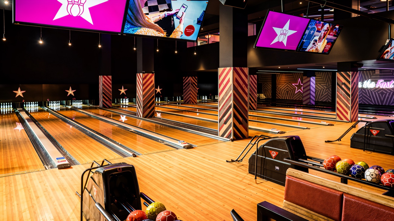 Tenpin's neon-lit lanes with big screens and colour-coded balls at the ready