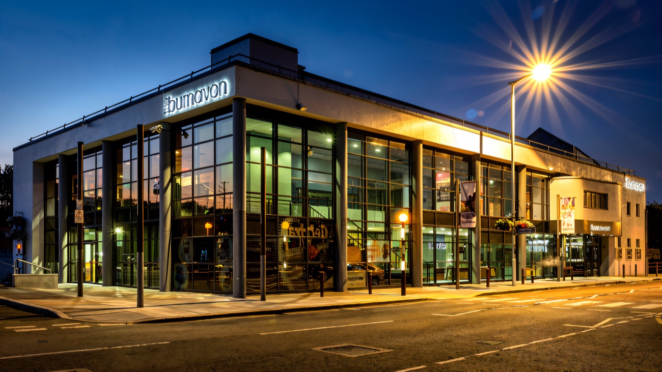 The glass-fronted centre lit up at dusk