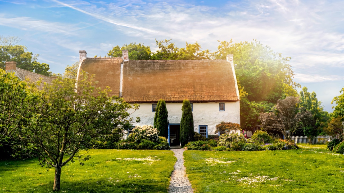 A whitewashed thatched cottage in its garden at the Ulster Folk Museum, Cultra