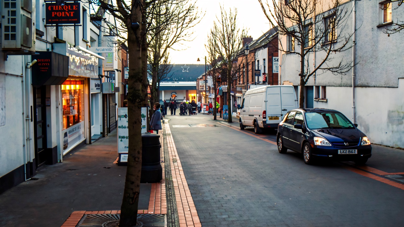 Looking down a pedestrianised Ballymena street towards one of the Tower Centre's entrances