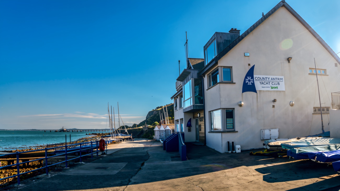 Dinghies parked on the slipway apron beside the County Antrim Yacht Club building